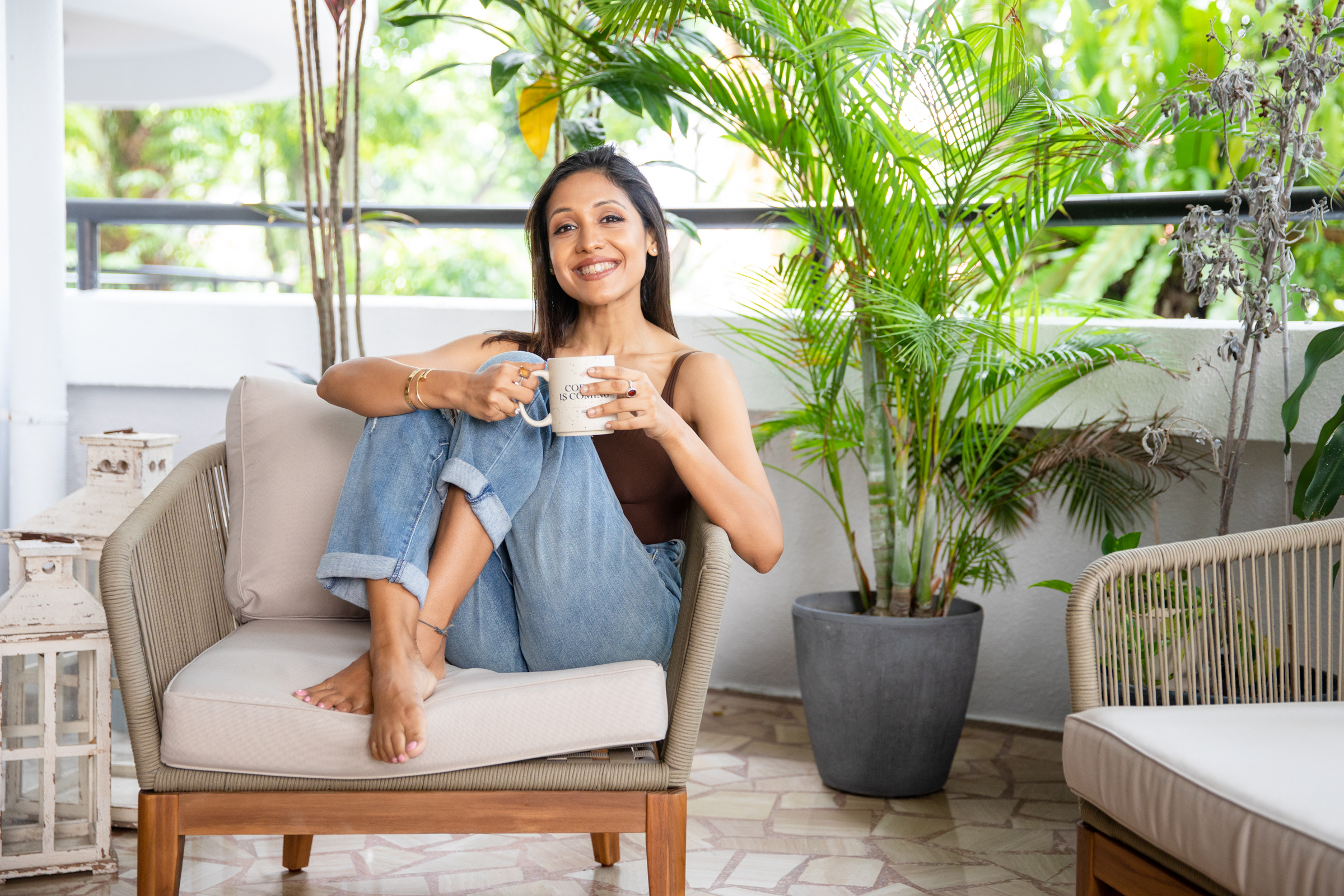 Swati Singh holistic wellness coach relaxing at home in Singapore